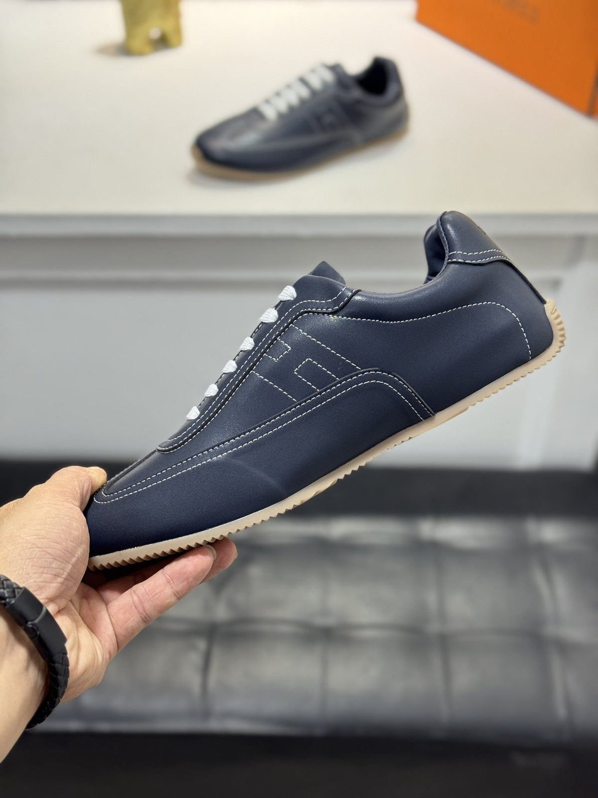 Hermès Contrast-Trim Low-Top Sneakers — side