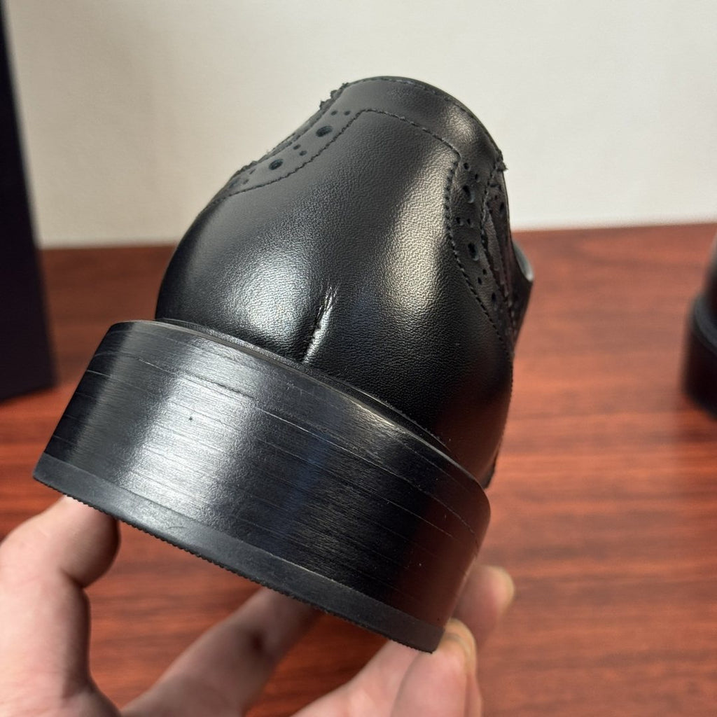 Prada Burnished Brogue Derby Shoes — detail